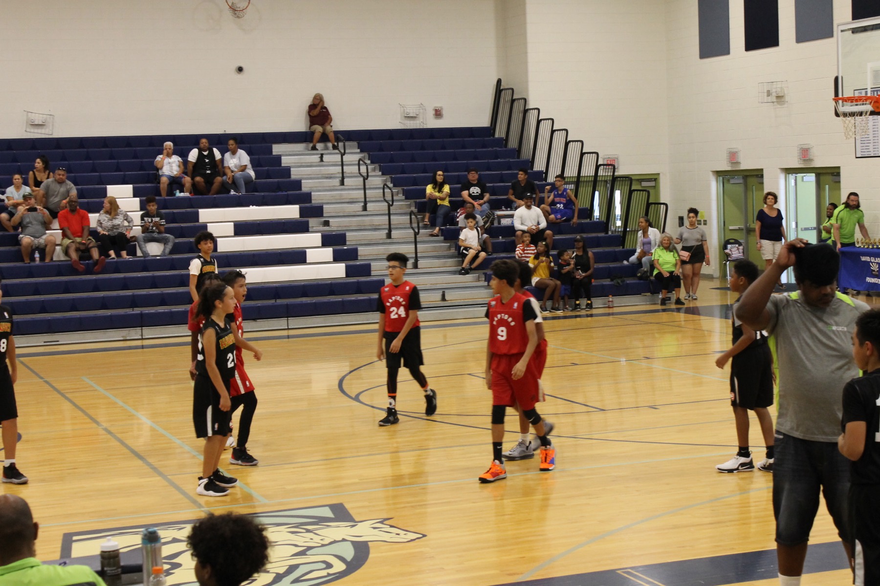 Families filling the bleachers at a league game