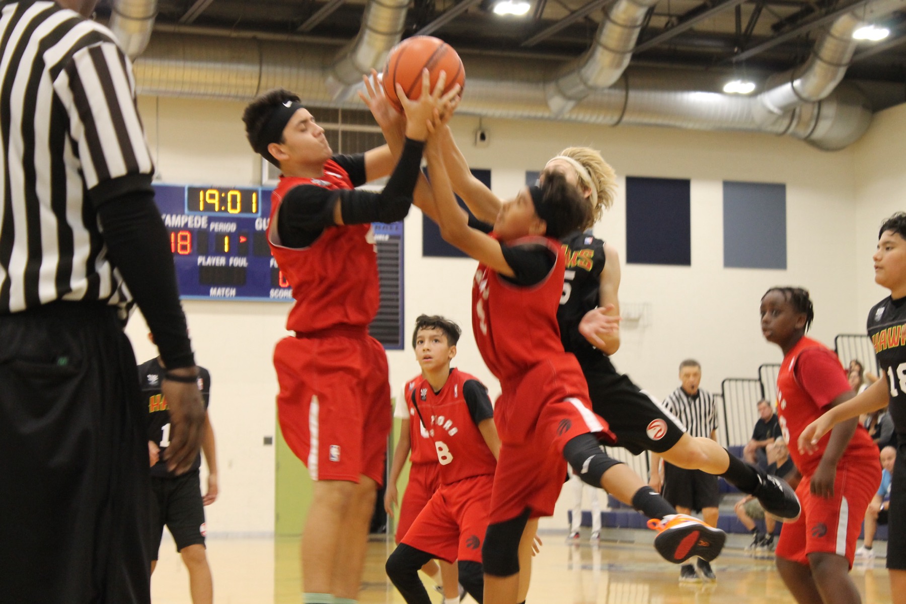Player going up for a layup in traffic